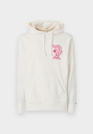 Cream hoodie made of soft fabric, featuring a kangaroo pocket and a pink graphic design with text on the front. Drawstrings at the hood.