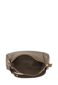 Green leather handbag with a zip closure. Features a textured exterior, interior lining, and a single adjustable strap.