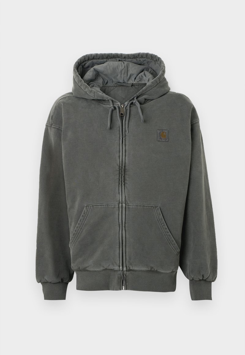 Felpa grigia con zip, finitura testurizzata, cappuccio con cordino, tasche a marsupio e polsini a costine. Presenta una piccola etichetta con il logo sul petto.