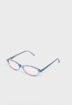 Blue translucent oval eyeglasses with light pink tinted lenses resting on a white surface.