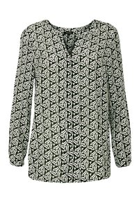 Chemisier à manches longues en motif géométrique noir et blanc, avec un col en V et un tissu doux avec une légère texture.