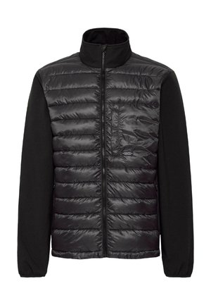 Veste noire avec un devant en nylon matelassé et des manches en polaire noire contrastantes. Elle présente un col haut, une fermeture éclair sur toute la longueur et des poches sur les côtés.