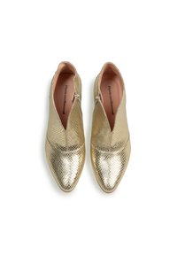 Gold metallic shoes with a textured, patterned surface, featuring a pointed toe design and a zip closure on each side.