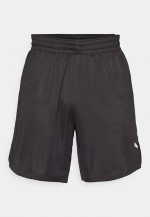 Zwarte sportshorts met een elastische tailleband, gladde stof en zijslitsen. Bevat een klein logo op het rechteronderbeen.