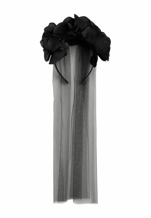 Black floral headband with large fabric flowers and attached long sheer black veil hanging down.