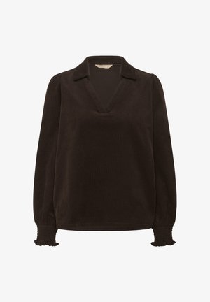 Must mustrakk blouse V-kaelusega ja kraega. Omab smockitud mansette ja pikki varrukasid, sileda tekstuuri ning mugavat lõiget.