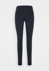 Leggings noirs ajustés en tissu extensible, avec une texture lisse, des zips aux chevilles et une taille haute.
