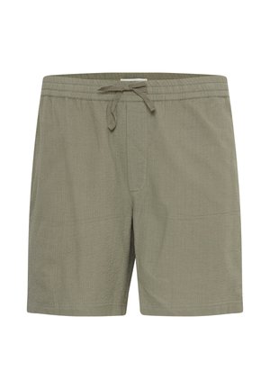 Shorts de bain vert olive avec une taille élastique, un cordon de serrage, et un tissu texturé, présentant une coupe décontractée et deux poches latérales.