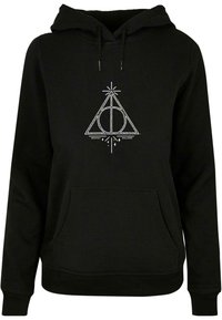 Black hooded sweatshirt featuring a white Deathly Hallows symbol, with a front pocket and drawstring hood. Soft fabric with a casual fit.