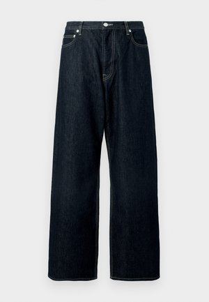 Donkerblauwe wijde denimjeans met een sluiting van knoop en rits aan de voorkant, riemlussen en zichtbare stiksels op de zakken en naden.
