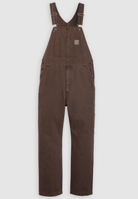 Bruine denim tuinbroeken met verstelbare schouderbanden, een voorzak met label, zijknopen en een rechte pasvorm.