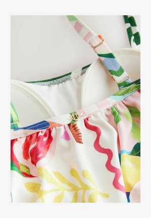 Kleurrijk bloemendessin badpak met een crèmekleurige achtergrond, verstelbare banden, geplooide halslijn en een gouden hardware-detail aan de achterkant.