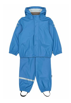 Modrý nepremokavý pršiplášť s elastickými manžetami, podšitou kapucňou a reflexnými pásikmi na nohaviciach pre lepšiu viditeľnosť. Vyrobený z hladkého, odolného materiálu.