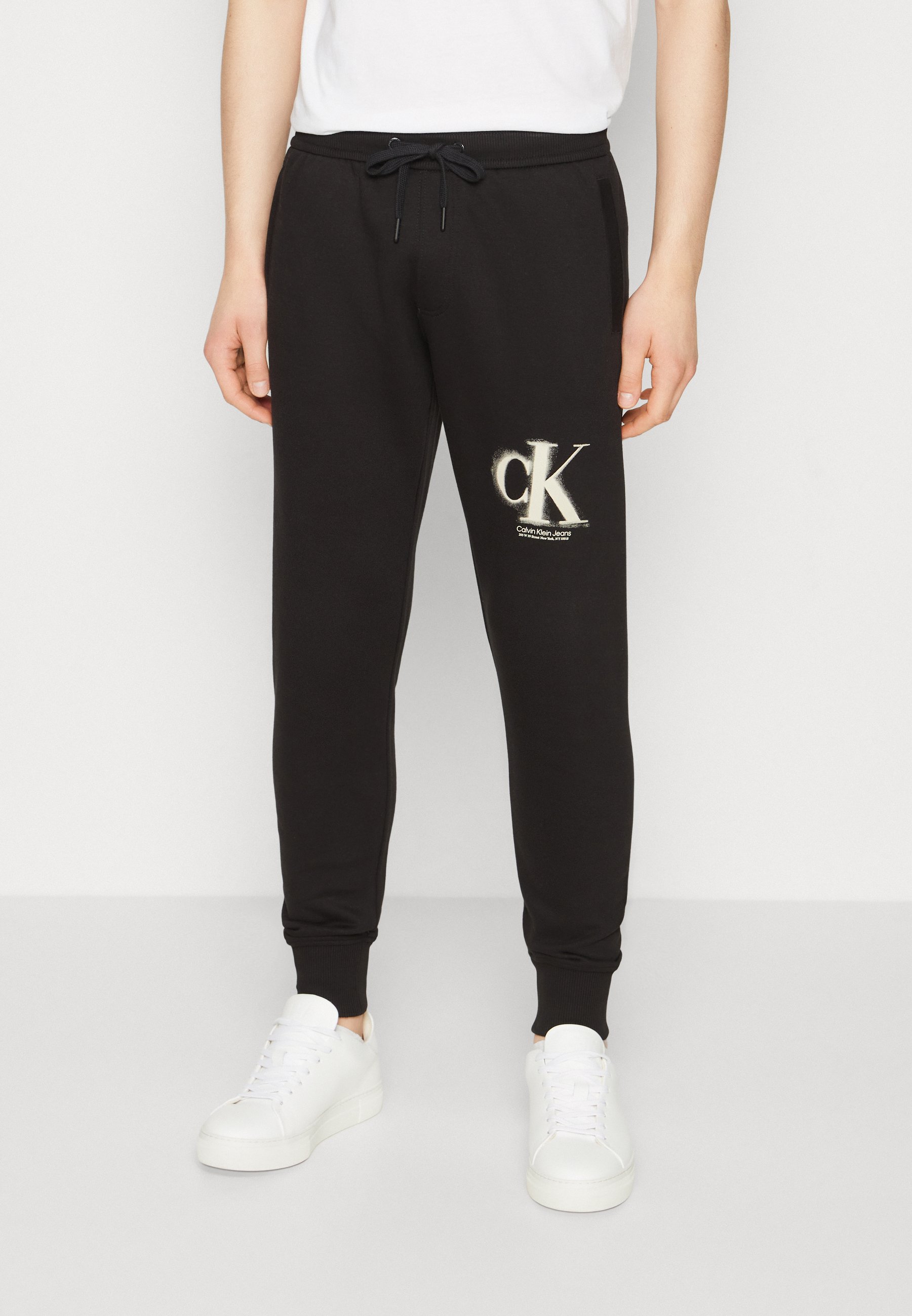 Calvin Klein Jeans SPRAY PANT - Tracksuit bottoms - black 