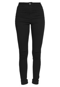 Mustat korkeavyötäröiset farkut, jotka on valmistettu denimestä, kapealla leikkauksella, ommellut yksityiskohdat ja polvikatkaisut lisäävät tekstuuria.