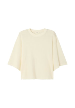 Kurzärmliges Oberteil mit Rundhalsausschnitt aus weichem, strukturiertem cremefarbenem Stoff. Es hat eine lockere Passform mit leicht kurzem Saum und überschnittenen Schultern.