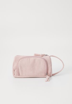 Pink corduroy pouch with a zipper, featuring ribbed texture, a side handle, and a front pocket. Compact and rectangular shape.