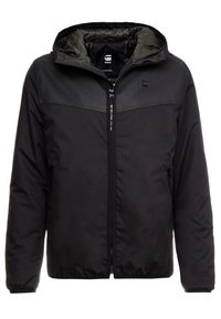 Black padded jacket with a zip closure, adjustable hood, and a solid texture. Features a contrasting upper panel and side pockets.