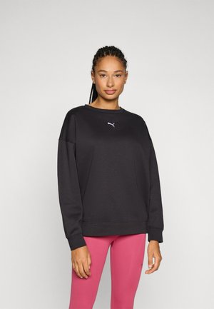 Black sweatshirt with a classic crew neck and ribbed cuffs, featuring a small white Puma logo on the chest. Soft, cotton blend fabric.
