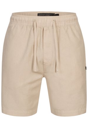 Beige shorts med teksturert finish, elastisk midje og snor. Merket synlig inne i midjen. Enkelt design, ingen mønstre.