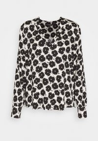 Blouse blanche à manches longues avec un imprimé floral abstrait de coquelicots noirs, décolleté en V et poignets boutonnés, présentée sur fond blanc uni.