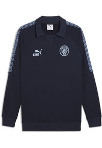Polo a maniche lunghe blu mare con colletto, logo PUMA, stemma del Manchester City e pannelli laterali con motivo. Realizzata in tessuto morbido e traspirante.