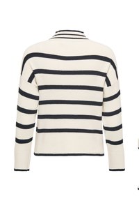 Svītraina džemperis ar apaļu apkakli, ar tumši ziliem svītrām uz bēša fona, ar ribveida tekstūru un garām piedurknēm ar piegulošām aprocēm.