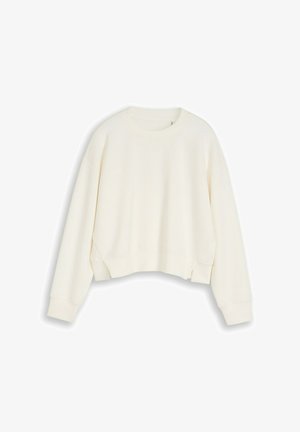 Šviesiai kreminis, ilgomis rankovėmis, su aukštu apykakliu ir ribinėtomis rankogaliais bei apačia, atkartotas plokščiai ant balto fono.