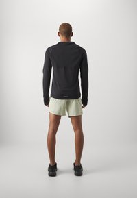 Nike Performance CHALLENGER SHORT - Sports shorts - olive aura/dark stucco/black/silver