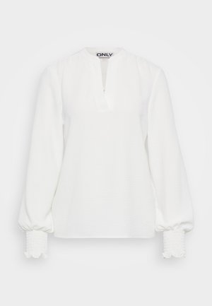 Bijela majica dugih rukava s placket izrezom, teksturiranom tkaninom i nabranim elastičnim manžetama. Jednostavan, opušteni kroj. Vidljiva oznaka brenda "ONLY" unutar.