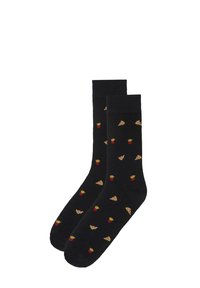 Calcetines negros de tripulación con un patrón repetido de pequeñas porciones de pizza y recipientes rojos de papas fritas.