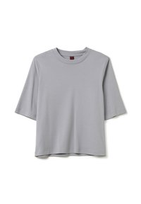 T-shirt grigio a maniche corte realizzato in tessuto morbido, con collo a giro e vestibilità rilassata, caratterizzato da un design senza cuciture e senza modelli visibili.
