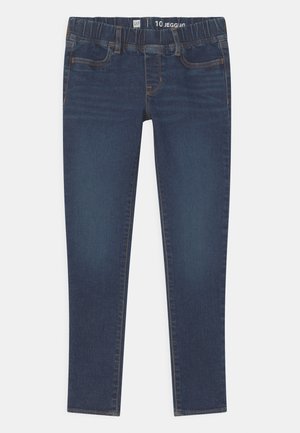 Jegging bleu foncé avec taille élastique, design à cinq poches et détails de couture subtils. Le tissu a une texture lisse et légèrement extensible.