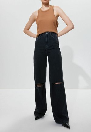 LOOSE WIDE  - Flared Jeans - washed black