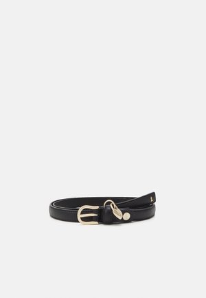 Black leather belt with gold buckle and small gold charm, coiled on a plain light gray background.
