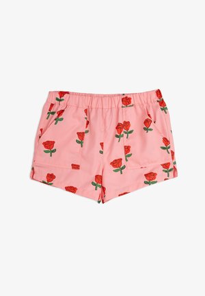 Pantalones cortos rosas hechos de una tela con un estampado floral que presenta rosas rojas y tallos verdes. Cintura elástica y dos bolsillos delanteros.