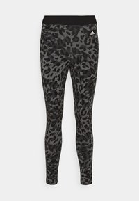Collant leopardati in nero e grigio con una ampia fascia in vita nera. Realizzati in un materiale elasticizzato, presentano un motivo testurizzato su tutta la superficie.