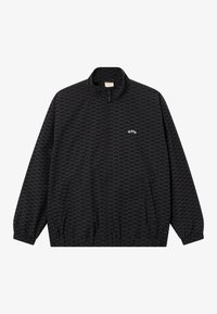 Veste noire zippée avec col montant, présentant un motif de logo intégral, des poignets élastiques et une coupe décontractée.