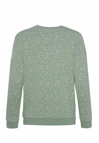 Sweatshirt vert avec un motif tacheté blanc, col rond et manches longues. Fabriqué en tissu doux avec des poignets et un ourlet côtelés.