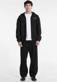 Guess Jeans MIT REISSVERSCHLUSS - Bluză de molton cu fermoar - schwarz