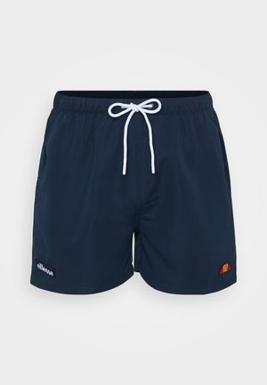 Tumed sinised ujumispüksid elastse vöökoha ja valge paelaga. Omavad küljetaskuid ja väikest logoaplikatsiooni vasakul jalal.