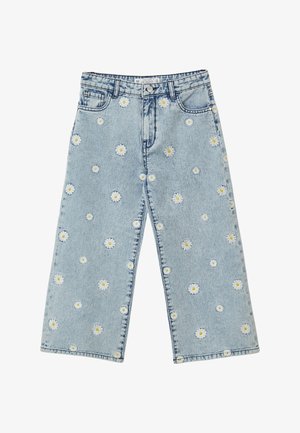Jean large en denim bleu clair avec des marguerites blanches brodées. Conception classique à cinq poches avec une braguette zippée et une fermeture par bouton.
