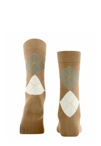 Calzini marroni e beige con un motivo a rombi verde e bianco, esposti in posizione verticale per mostrare i dettagli del design e della texture.