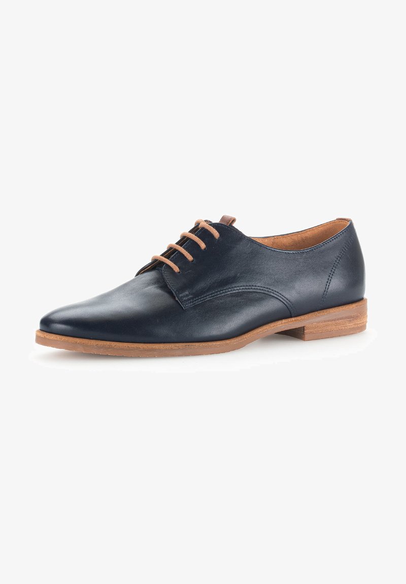 Marinblå lær oxford-sko med spiss tå, lysebrune snørebånd og flat tresåle. Glatt tekstur med et minimalistisk design.