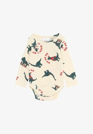 Body intero a maniche lunghe di colore crema con stampa di dinosauri in verde scuro e rosso. Tessuto a coste, chiusura a scatto sul fondo, tema festivo per le vacanze.