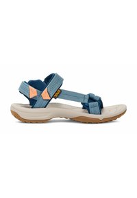 Sandalia Teva con un diseño en azul y gris, correas ajustables, suela acolchada, suela de goma texturizada y acentos naranjas contrastantes.