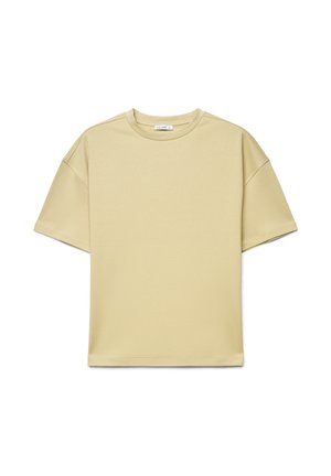 T-shirt beige à manches courtes et col rond, coupe décontractée avec épaules tombantes, présenté sur un fond blanc.