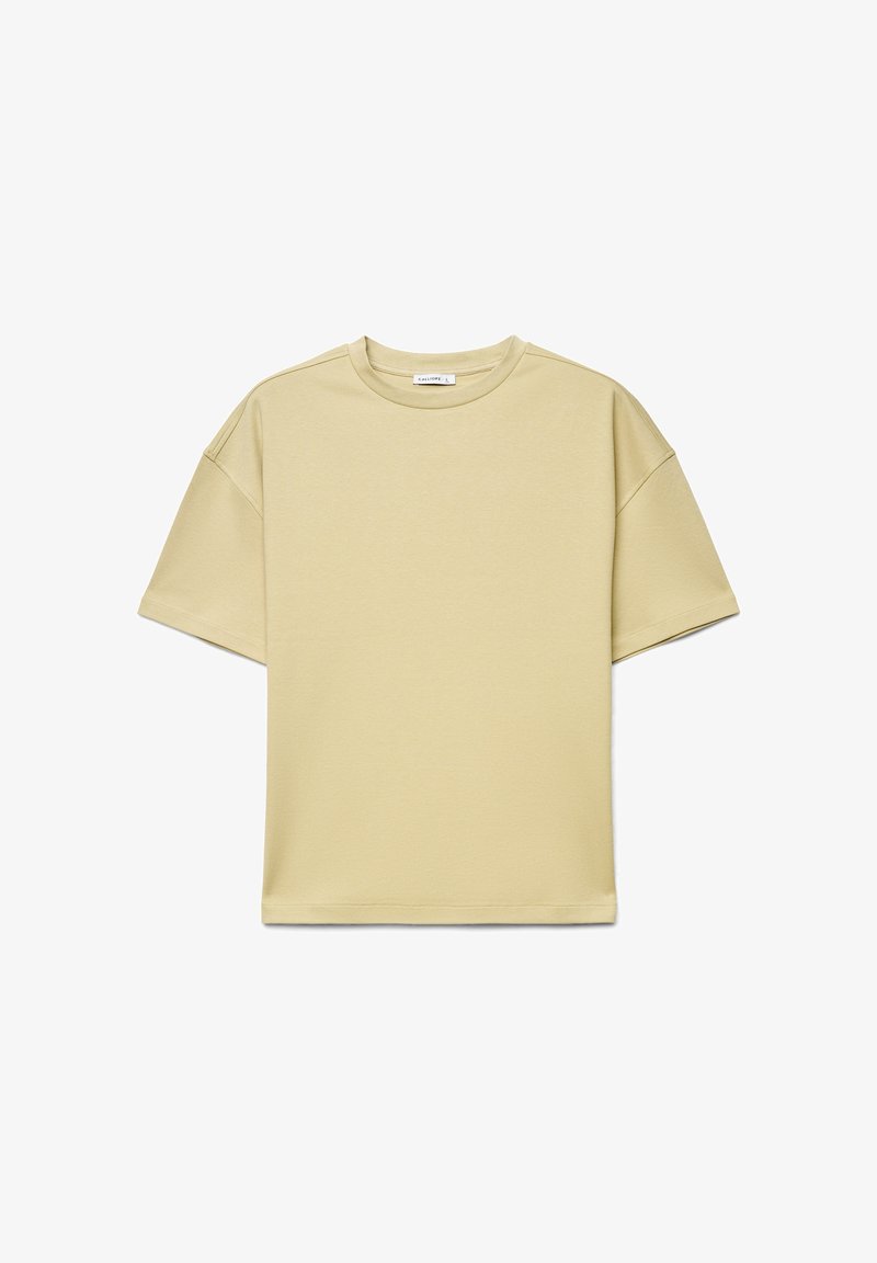 T-shirt beige à manches courtes et col rond, coupe décontractée avec épaules tombantes, présenté sur un fond blanc.