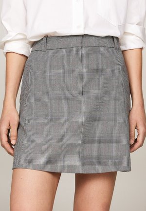 Grey plaid skirt with a structured waist, featuring a grid pattern and straight cut, made from a lightweight fabric.