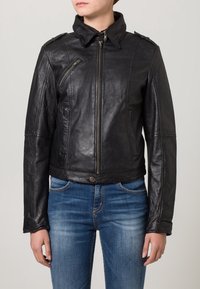 Black leather jacket with a zip front, stand collar, and multiple seaming details. Features two side pockets and an asymmetrical zipper.